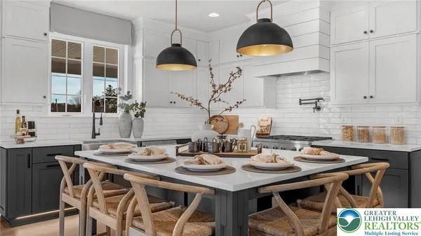 a kitchen with a sink a stove and cabinets