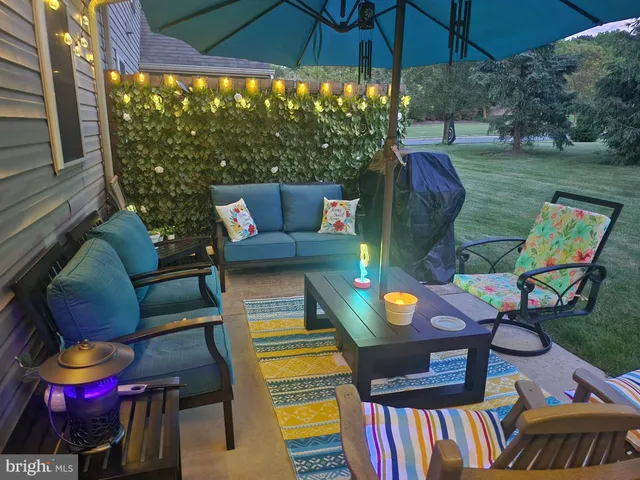 a view of a chairs and table in the patio