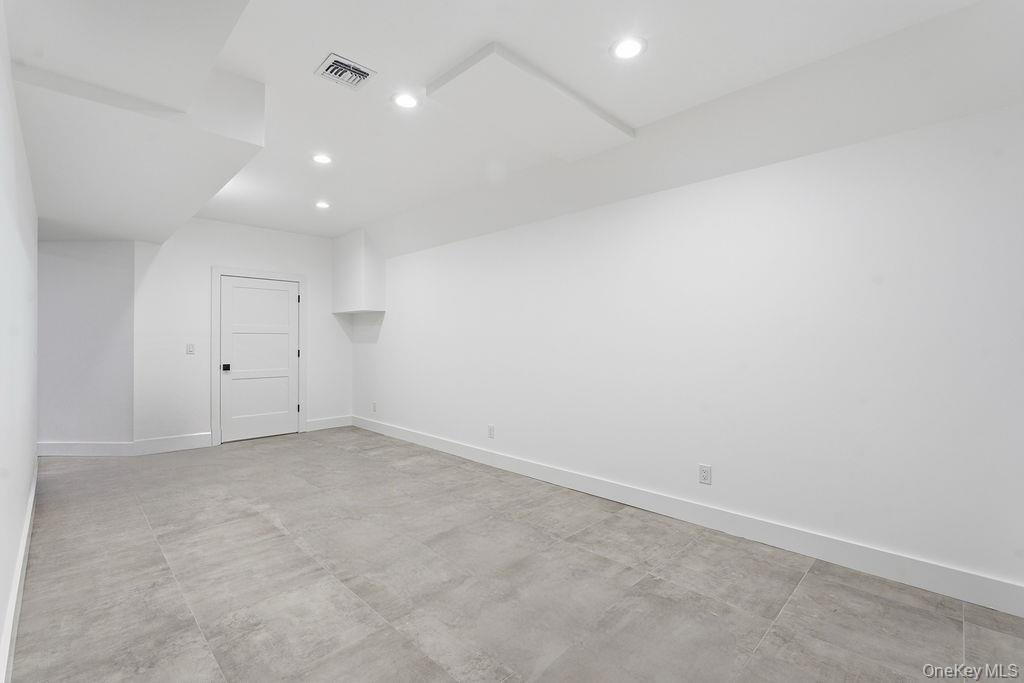 768 Bridgehampton Sag Harbor Bridgehampton, NY 11932 - Photo 32 of 35 Spare room with recessed lighting and concrete floors
