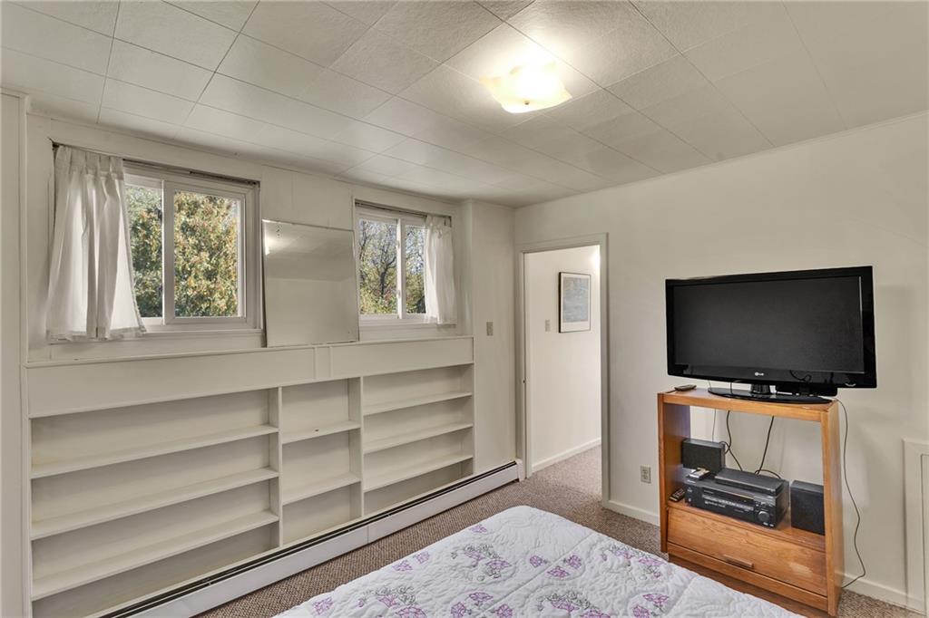 4032 Ewalt Road Gibsonia, PA 15044 - Photo 18 of 39 a living room with furniture and a flat screen tv