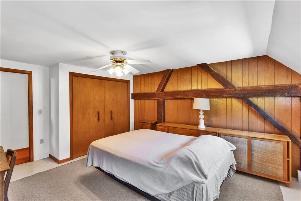 4032 Ewalt Road Gibsonia, PA 15044 - Photo 36 of 39 a bedroom with a bed and a chandelier