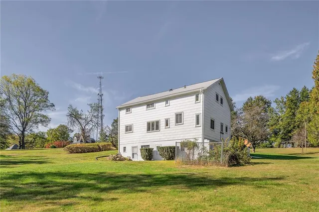 a view of a house with a big yard