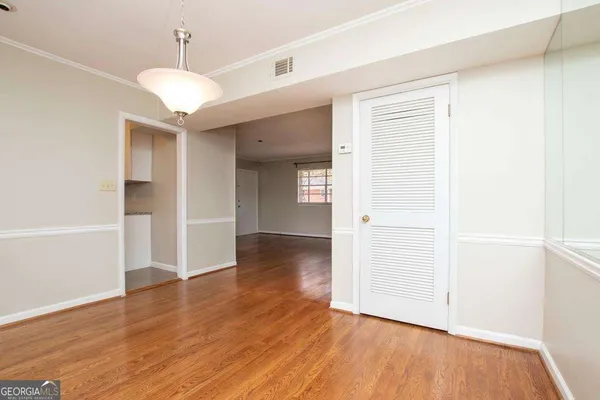 an empty room with wooden floor