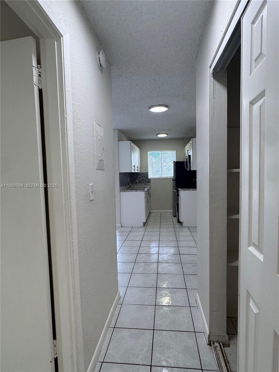 2150 Madison Street, Unit 20 Hollywood, FL 33020 - Photo 8 of 9 a bathroom with a sink and a mirror