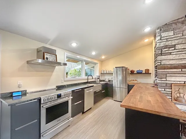 a kitchen with a stove and a refrigerator