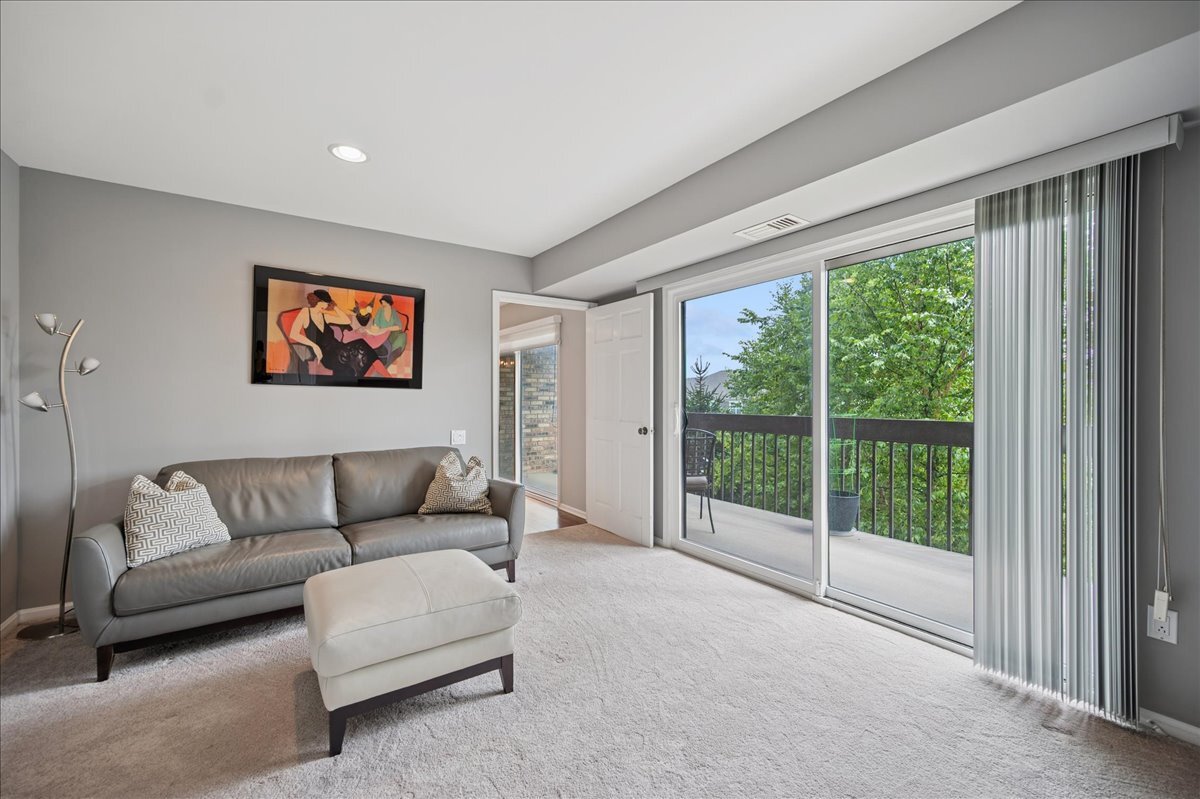 3741 Mission Hills Road, Unit 209 Northbrook, IL 60062 - Photo 12 of 18 a living room with furniture and a large window