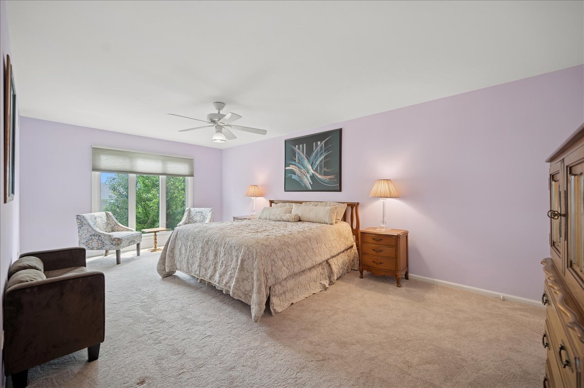 3741 Mission Hills Road, Unit 209 Northbrook, IL 60062 - Photo 13 of 18 a spacious bedroom with a bed and a couch