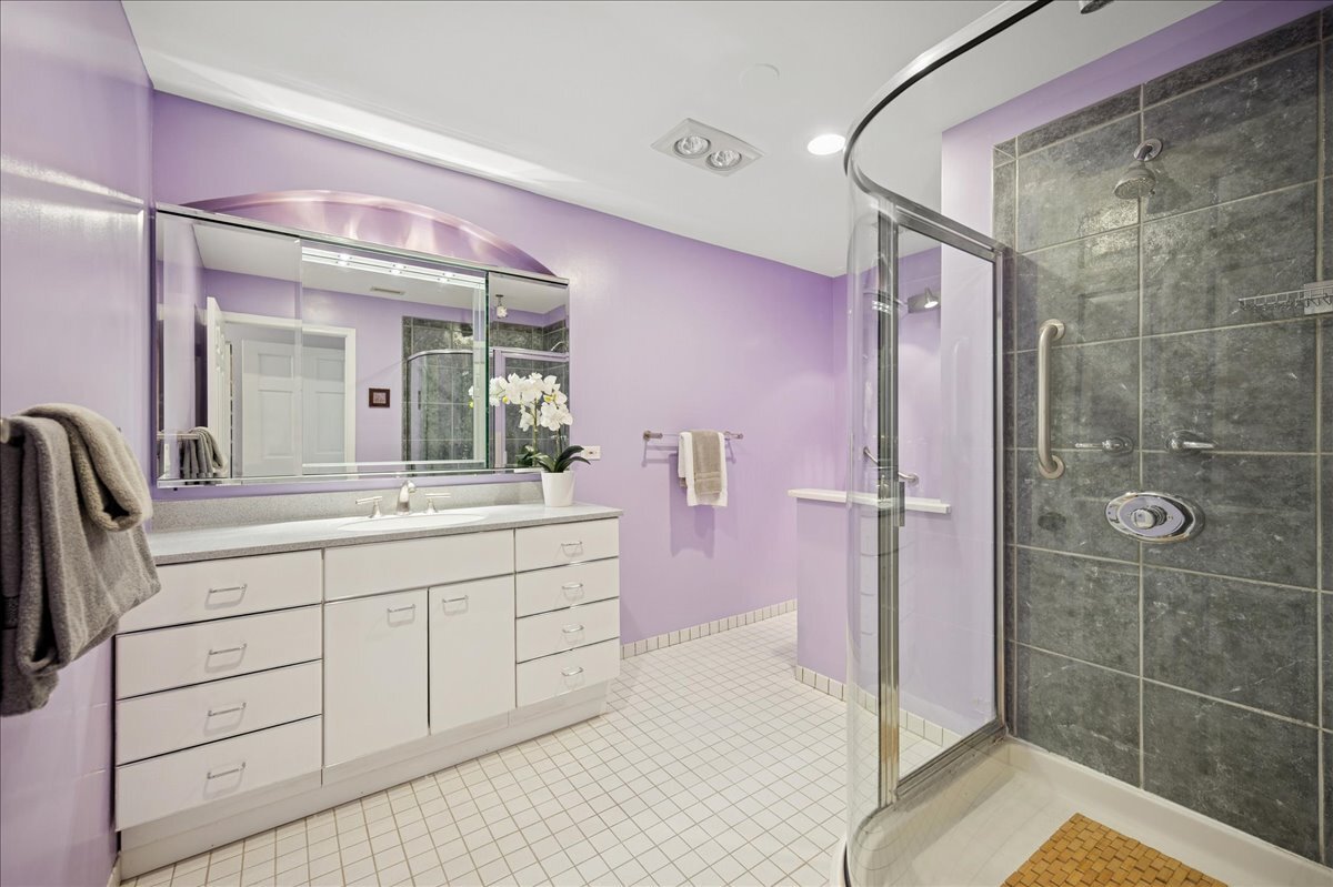 3741 Mission Hills Road, Unit 209 Northbrook, IL 60062 - Photo 14 of 18 a bathroom with a double vanity sink mirror and shower