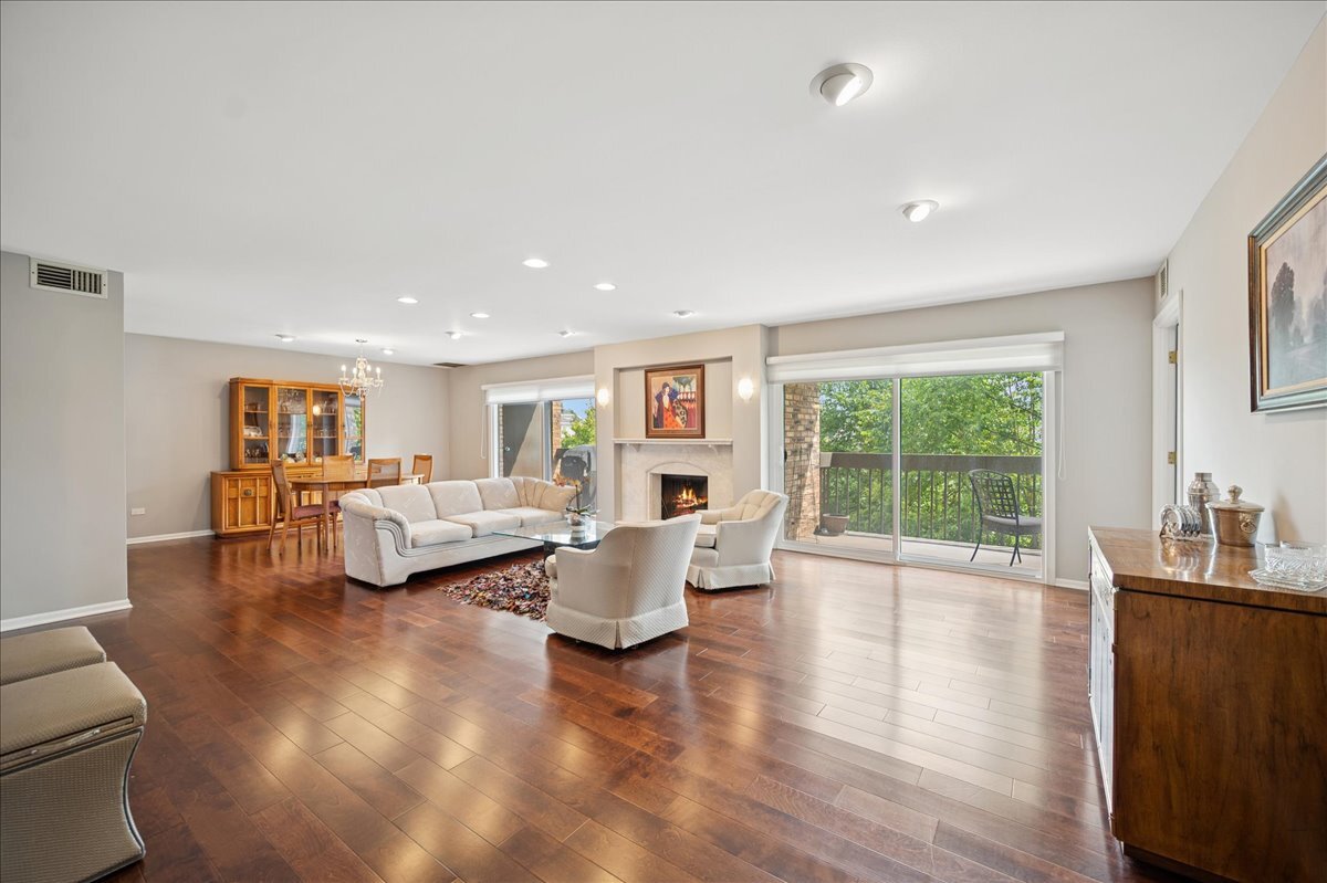 3741 Mission Hills Road, Unit 209 Northbrook, IL 60062 - Photo 3 of 18 a living room with furniture and wooden floor