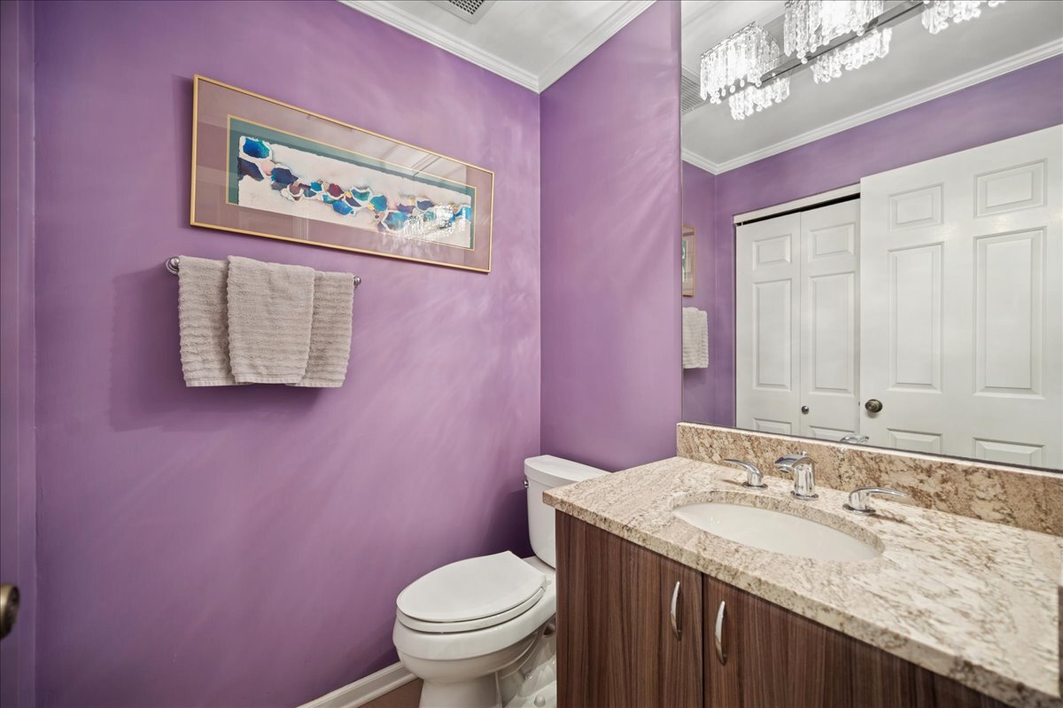 3741 Mission Hills Road, Unit 209 Northbrook, IL 60062 - Photo 10 of 18 a bathroom with a granite countertop toilet sink and mirror