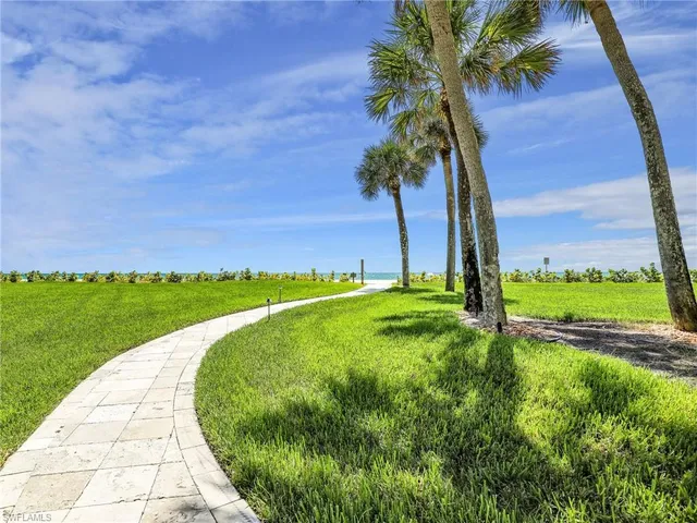 a view of a lake with a big yard