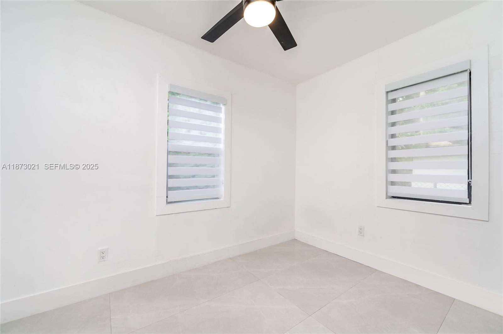 1946 Northwest 49th Street Miami, FL 33142 - Photo 24 of 29 an empty room with a window