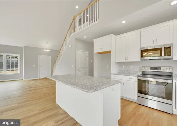 a bathroom with a sink a mirror and a toilet
