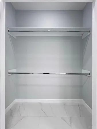 a view of an empty walk in closet