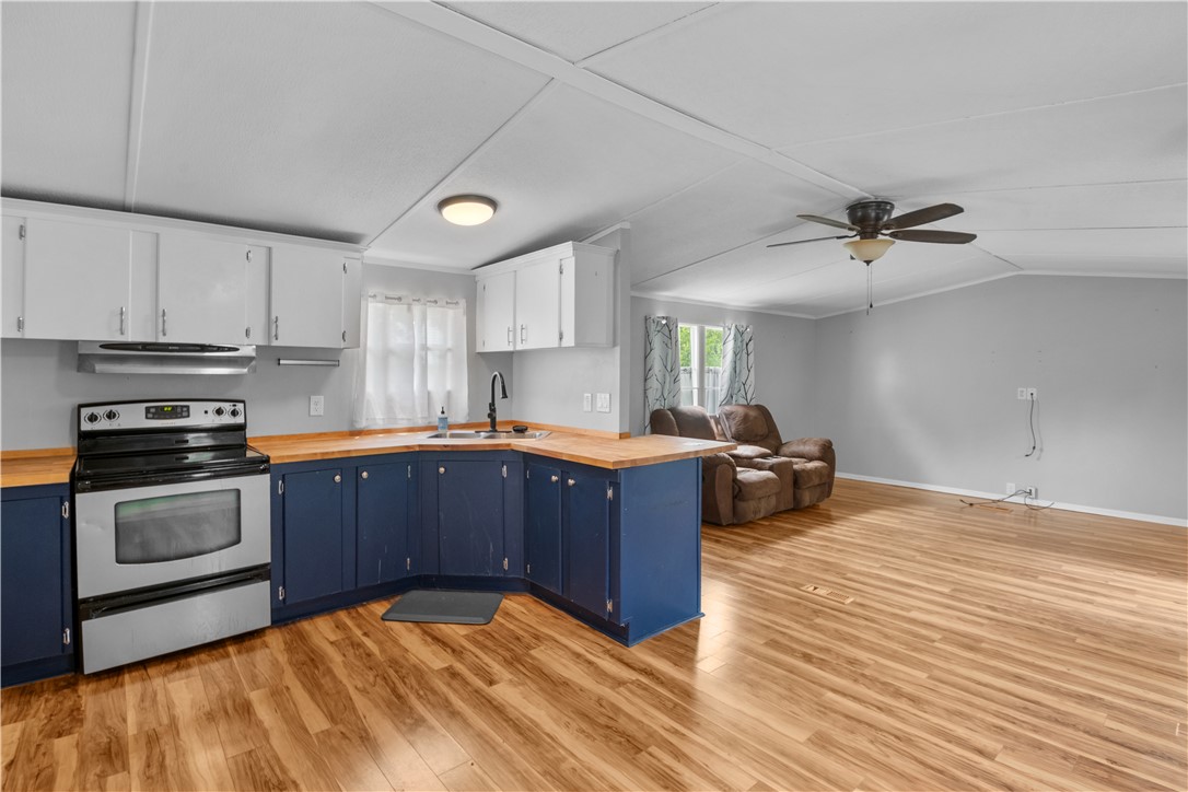 169 West Bagwell Road Liberty, SC 29657 - Photo 14 of 29 Functional kitchen with ample cabinet space opens into a spacious living area.