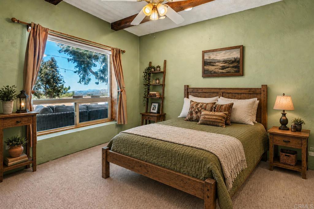 17089 Lawson Valley Road Jamul, CA 91935 - Photo 11 of 33 a bedroom with a bed and a flat tv screen on dresser