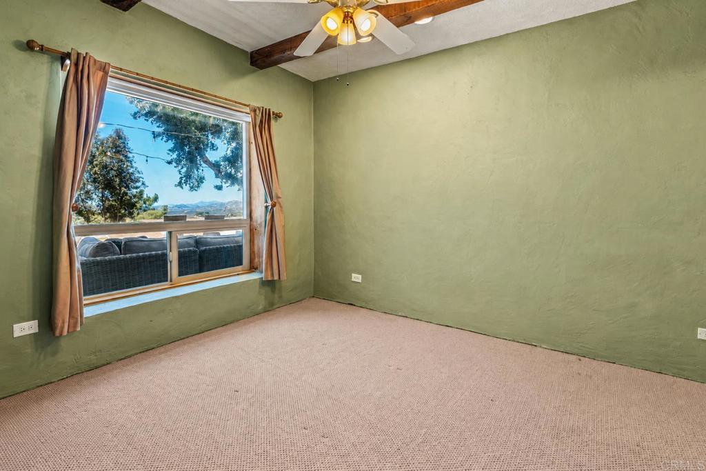 17089 Lawson Valley Road Jamul, CA 91935 - Photo 12 of 33 a view of a room with a large window with outer view