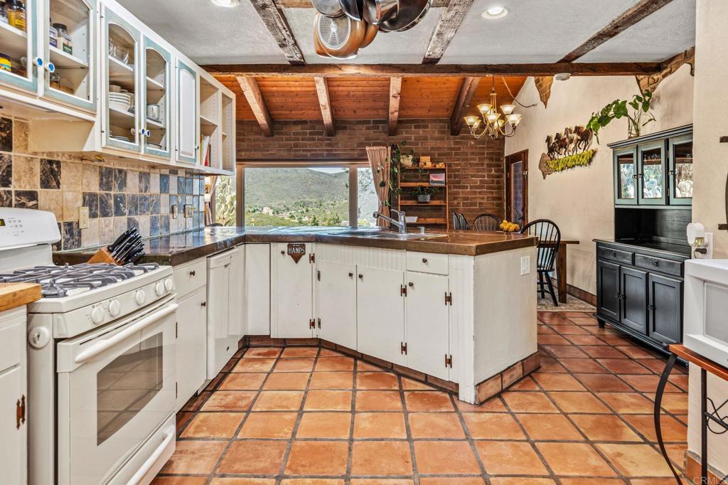 17089 Lawson Valley Road Jamul, CA 91935 - Photo 16 of 33 a view of a kitchen has a sink and cabinets