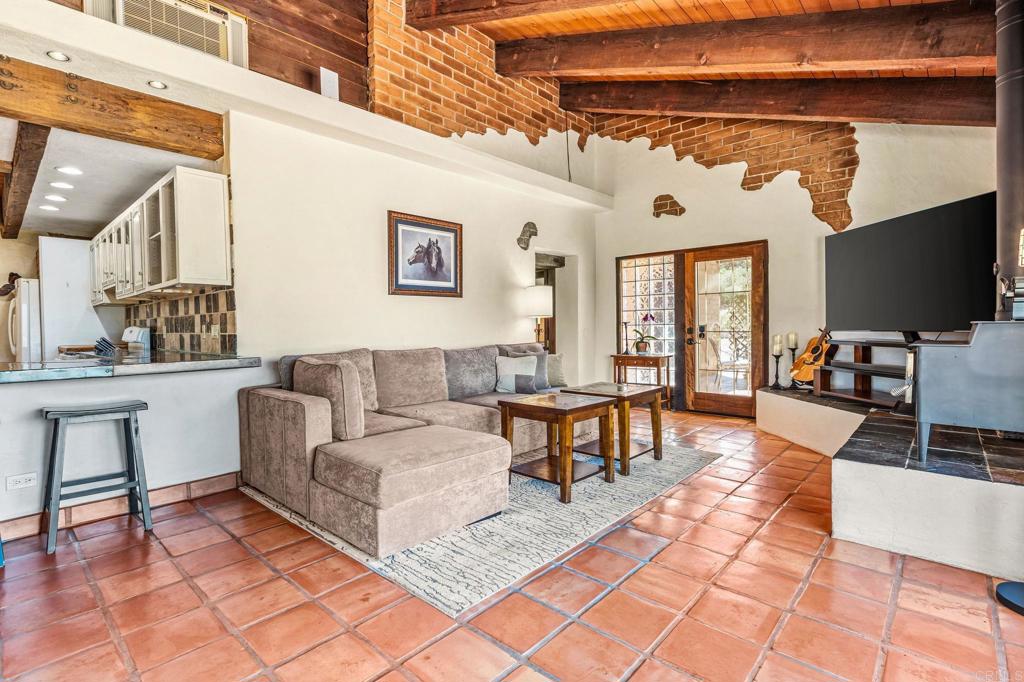 17089 Lawson Valley Road Jamul, CA 91935 - Photo 18 of 33 a living room with furniture and a flat screen tv