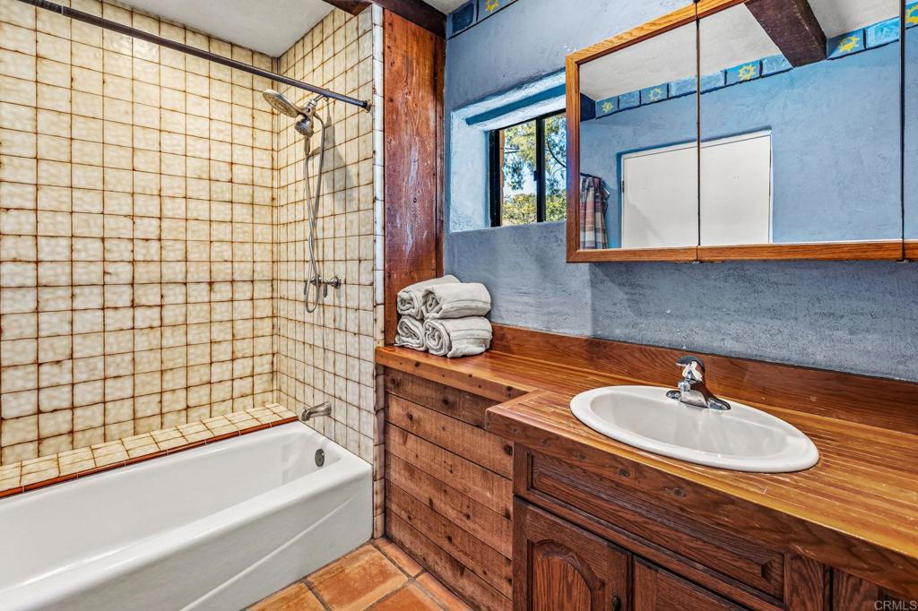 17089 Lawson Valley Road Jamul, CA 91935 - Photo 19 of 33 a bathroom with a sink and a bathtub