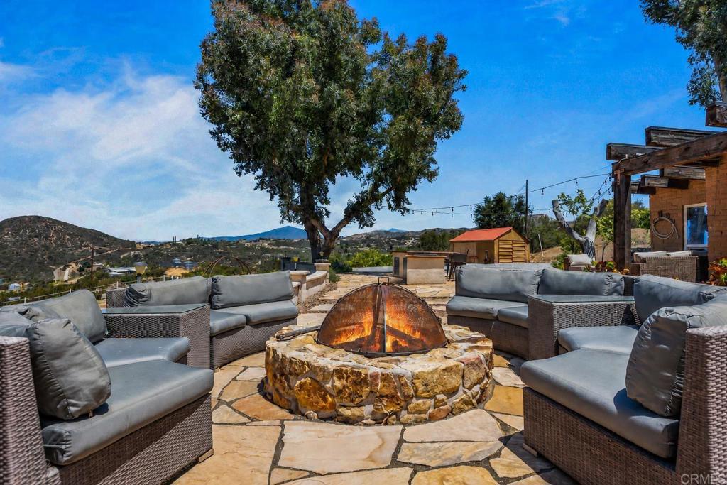 17089 Lawson Valley Road Jamul, CA 91935 - Photo 22 of 33 a outdoor living space with furniture and city view