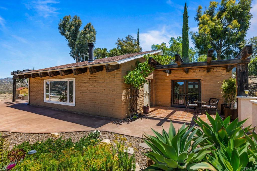 17089 Lawson Valley Road Jamul, CA 91935 - Photo 3 of 33 a front view of a house with a yard
