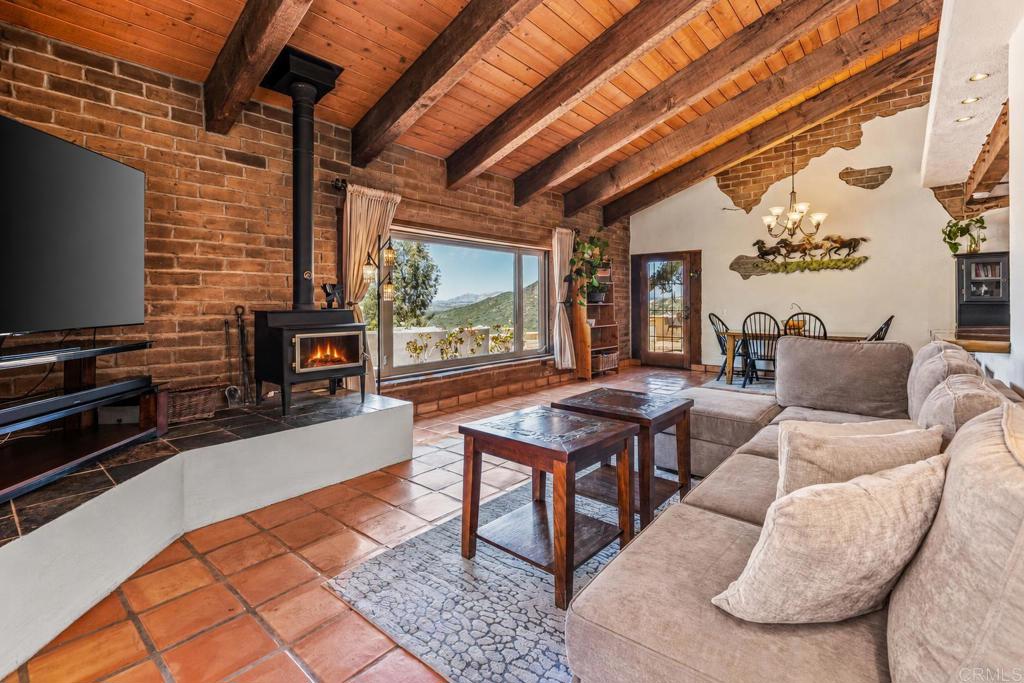 17089 Lawson Valley Road Jamul, CA 91935 - Photo 5 of 33 a living room with furniture and a flat screen tv
