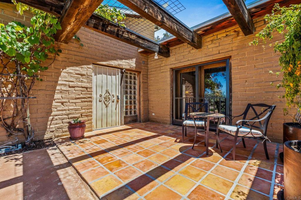 17089 Lawson Valley Road Jamul, CA 91935 - Photo 8 of 33 a view of a patio with a table and chairs