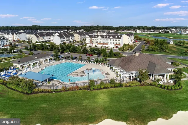 a view of a swimming pool with an outdoor space and seating area