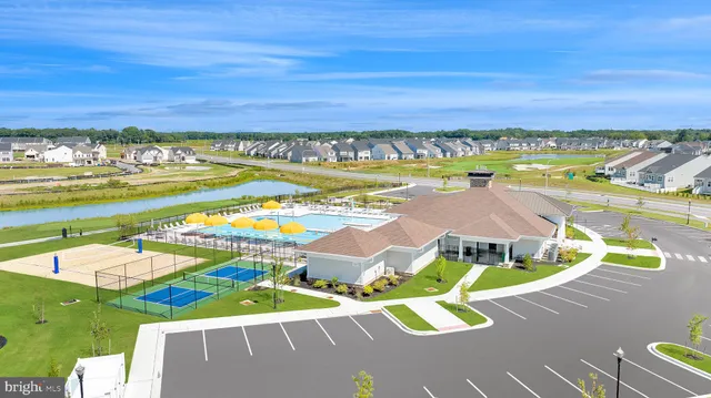 a view of a patio with couches and a table and chairs with garden view