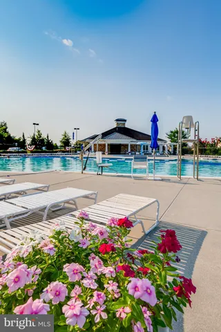 a front view of a house with a yard table and chairs