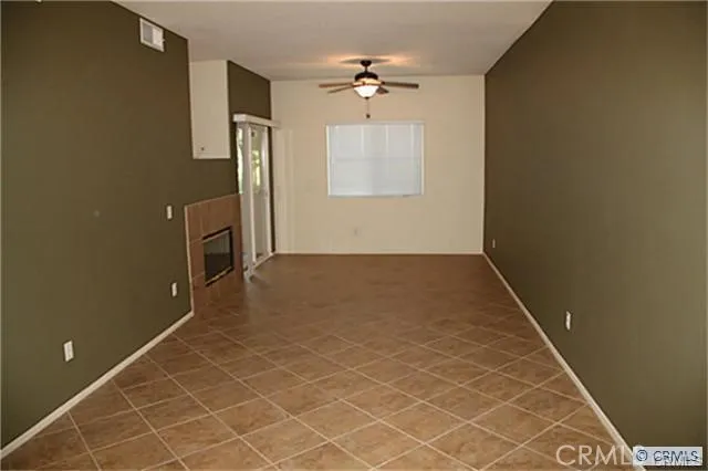 an empty room with a empty space and windows