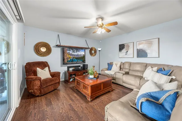 a living room with furniture and a large mirror