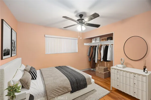 a bedroom with bed and a chandelier