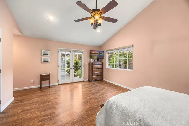 a view of a livingroom with a window and wooden floor