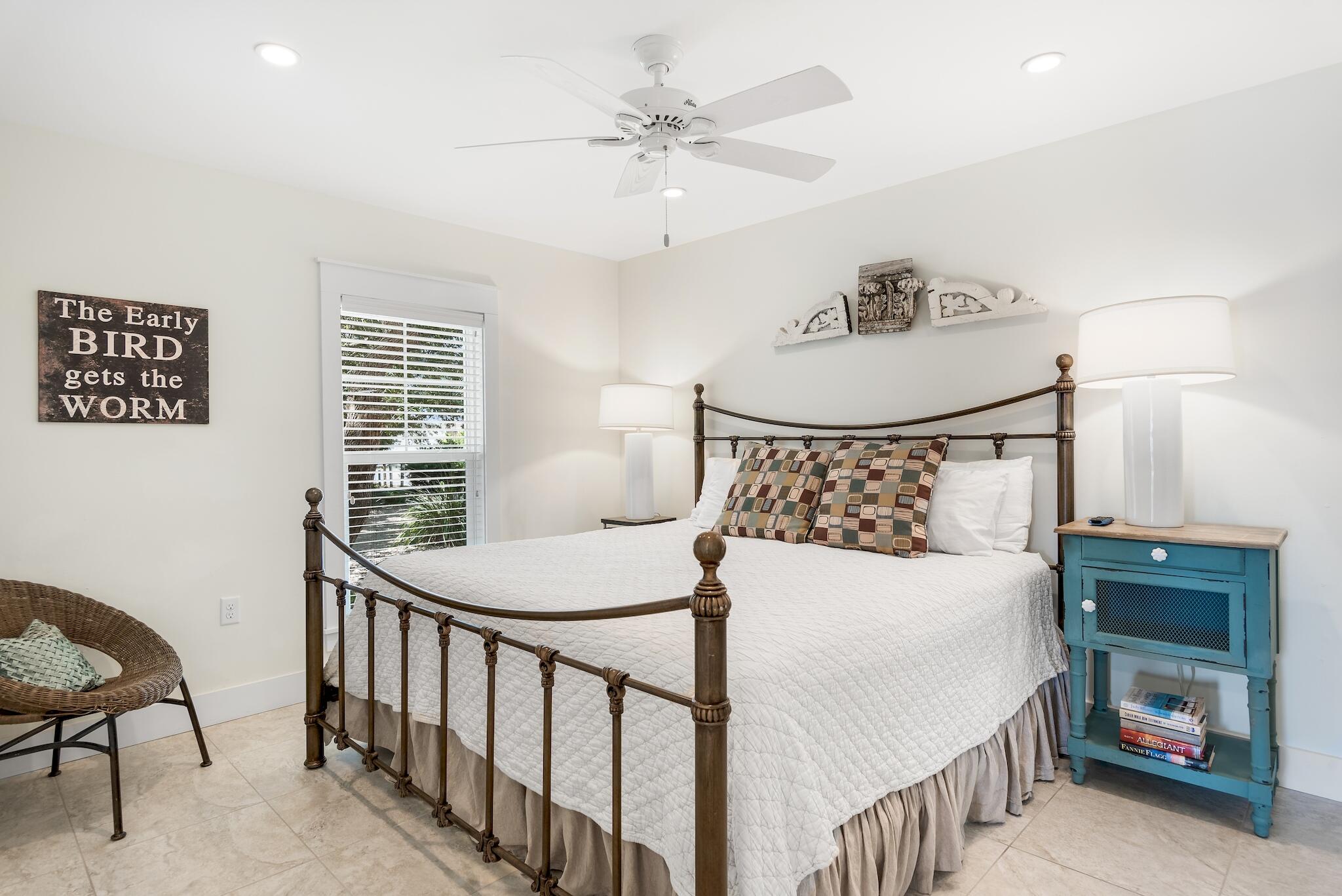 301 South Gulf Drive Santa Rosa Beach, FL 32459 - Photo 14 of 26 a bedroom with a bed and a chandelier