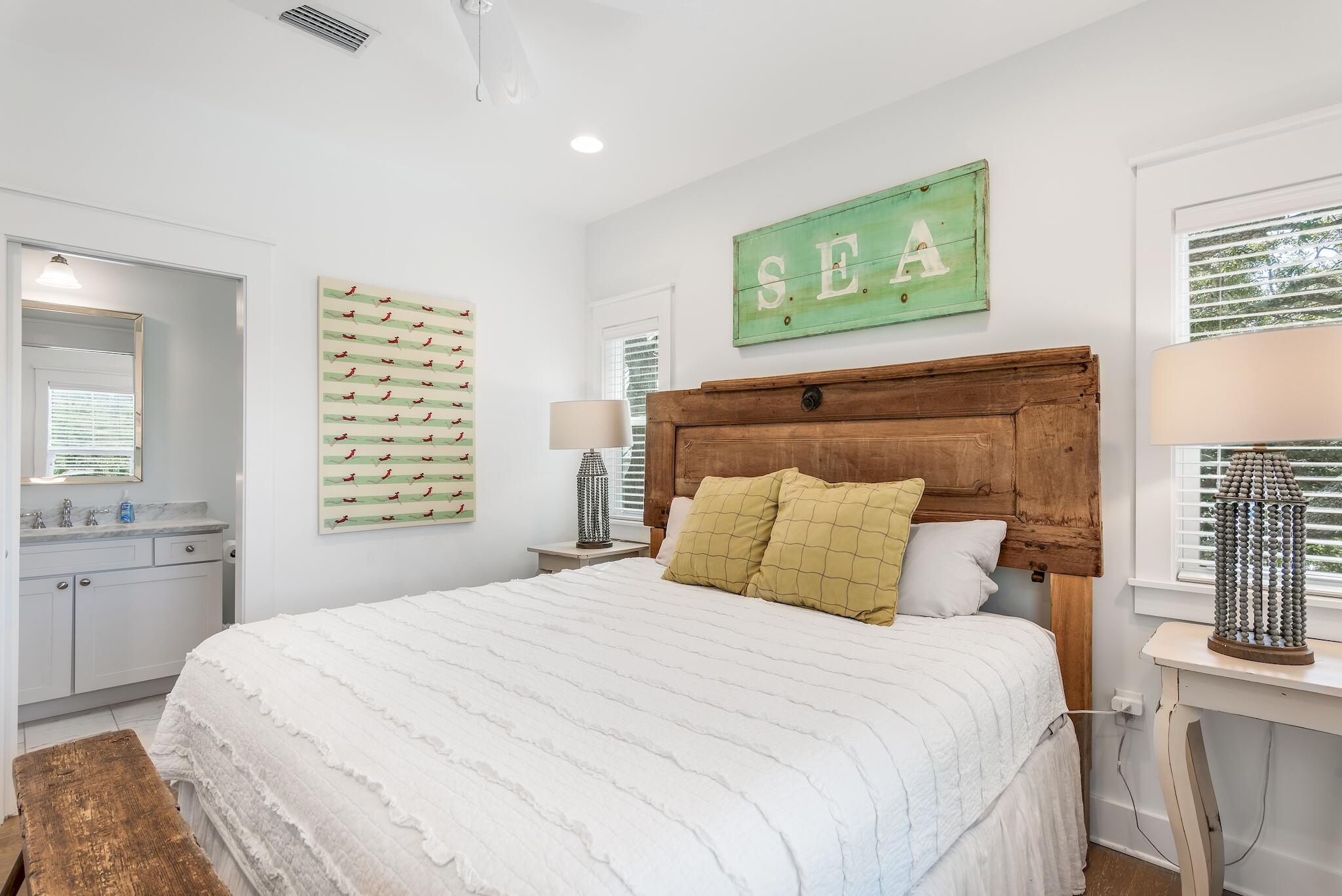 301 South Gulf Drive Santa Rosa Beach, FL 32459 - Photo 15 of 26 a bedroom with a large bed and a window