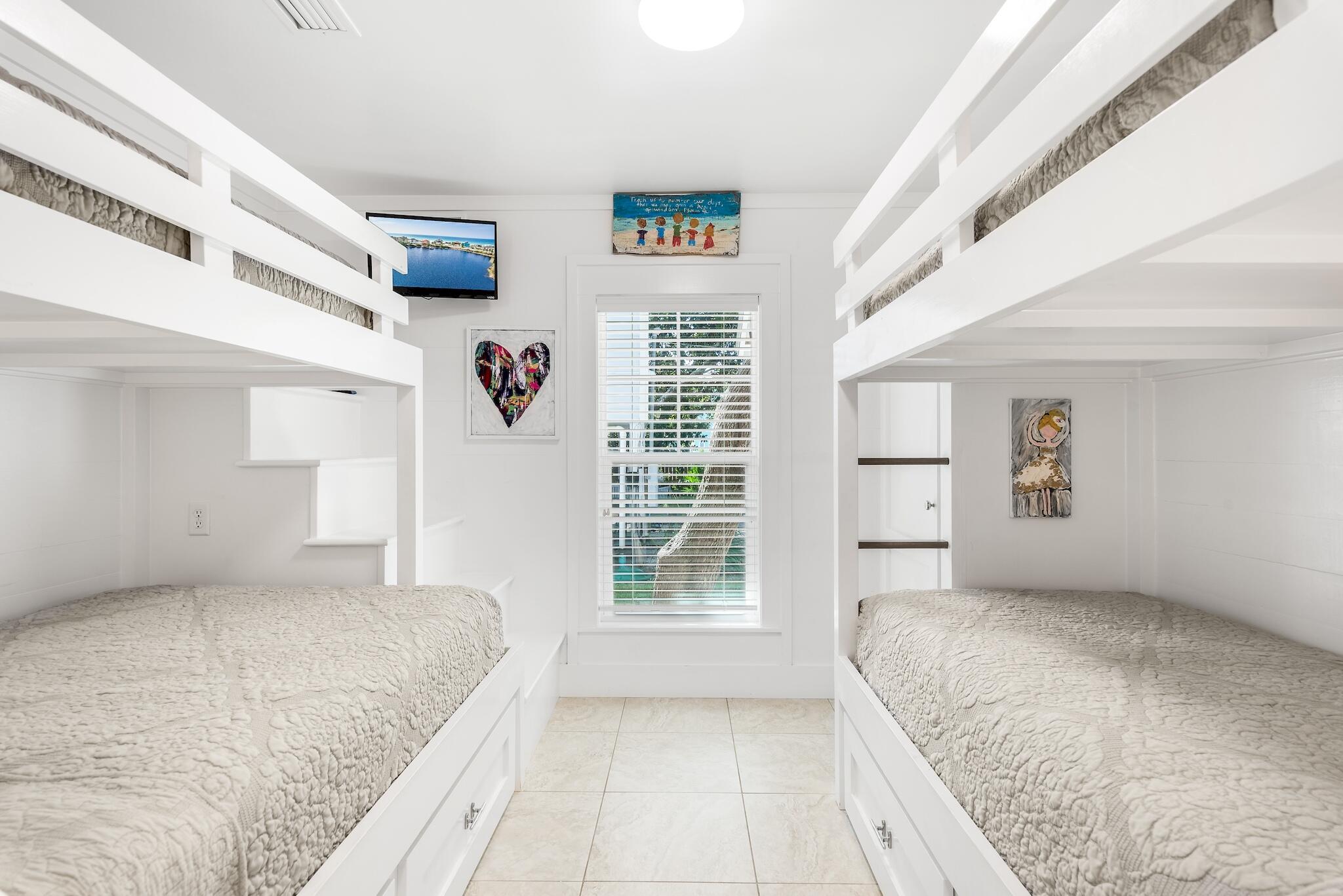 301 South Gulf Drive Santa Rosa Beach, FL 32459 - Photo 17 of 26 a bedroom with a large bed and a window