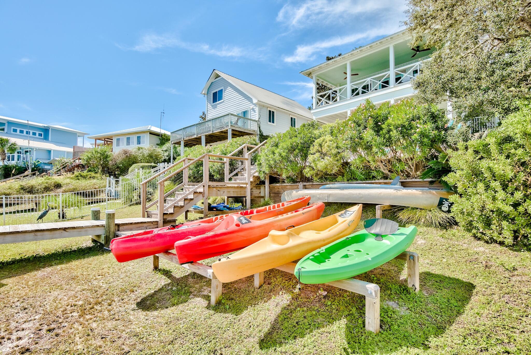 301 South Gulf Drive Santa Rosa Beach, FL 32459 - Photo 18 of 26 a wooden bench sitting in front of a building