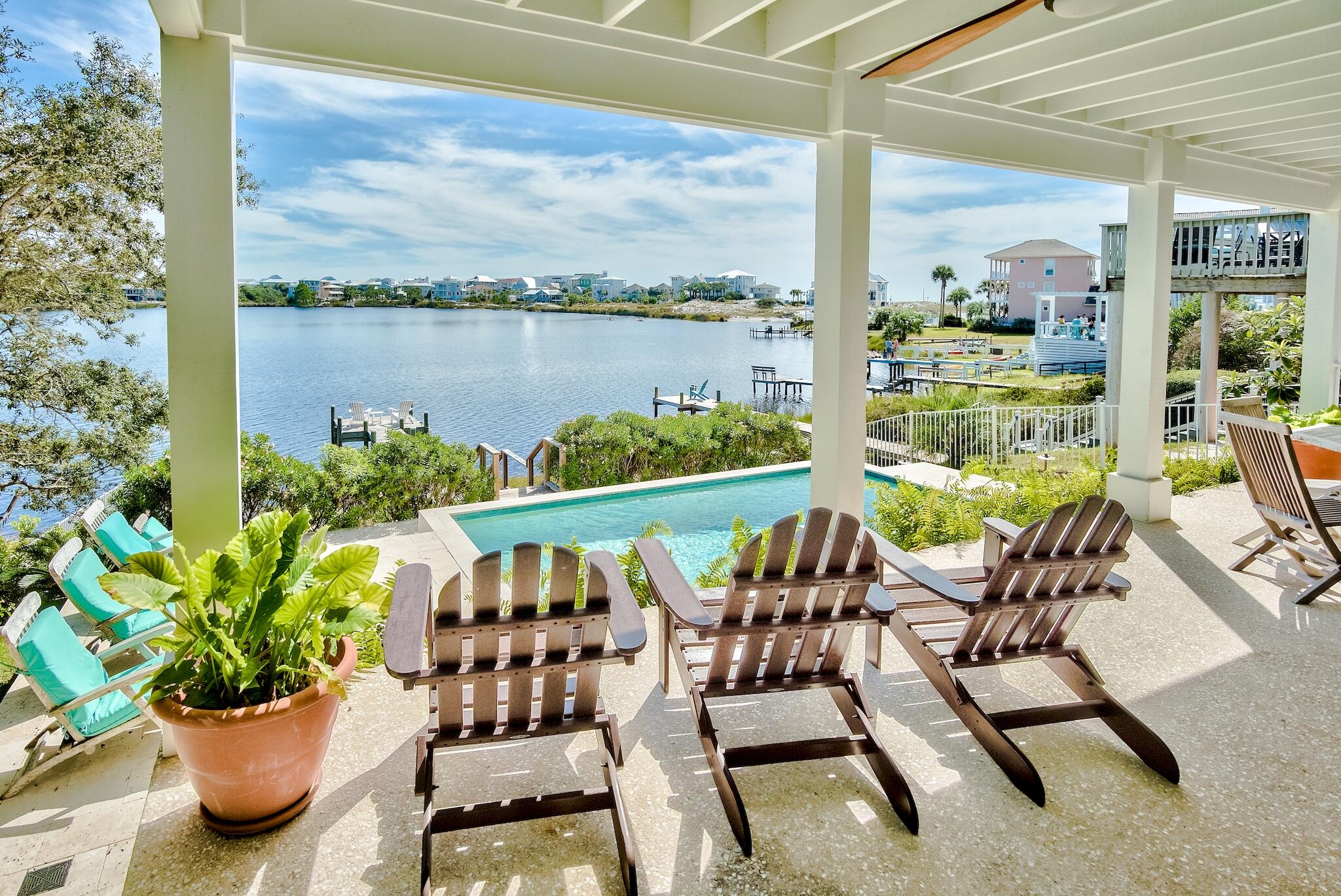 301 South Gulf Drive Santa Rosa Beach, FL 32459 - Photo 2 of 26 a view of an chairs and table in the patio