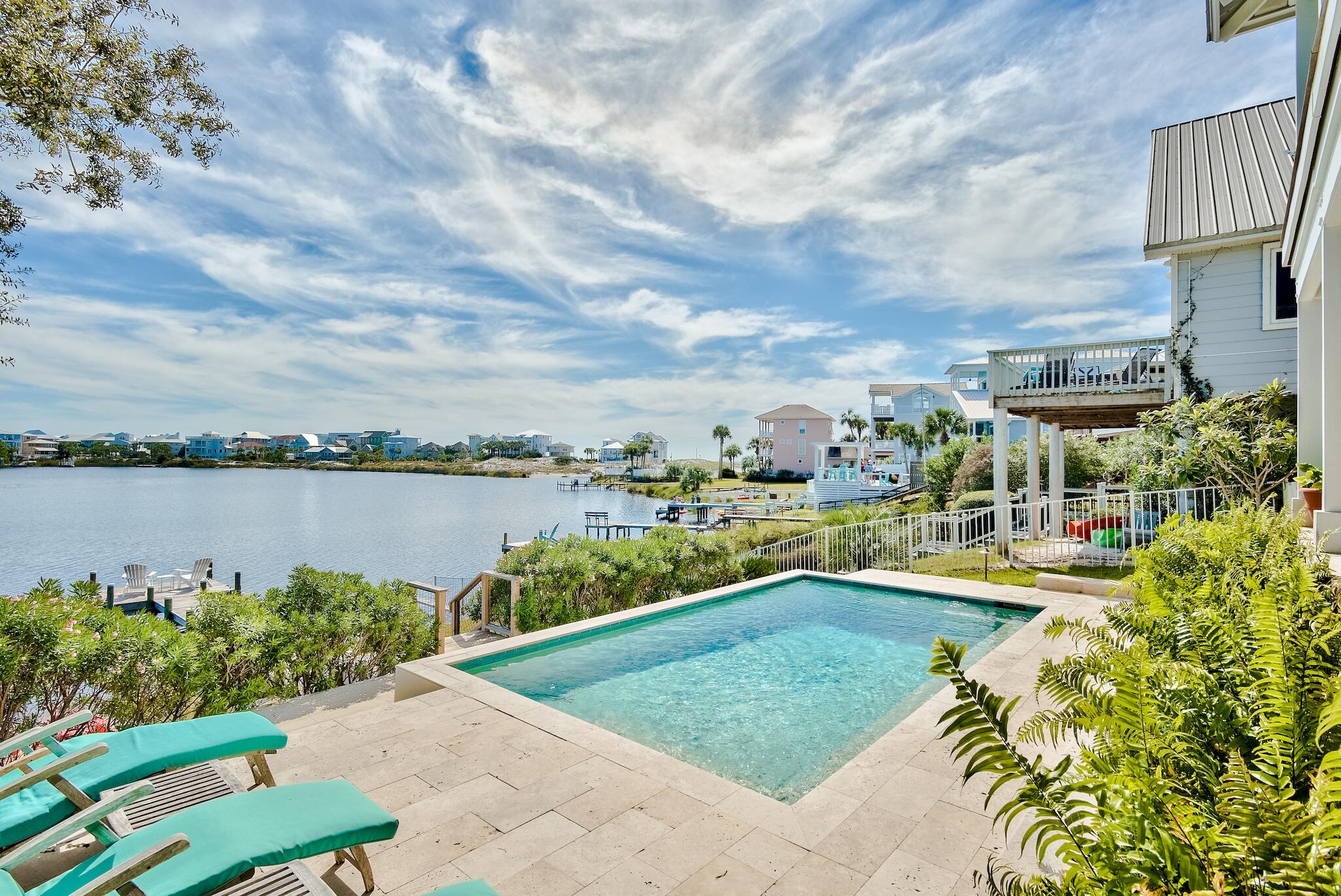 301 South Gulf Drive Santa Rosa Beach, FL 32459 - Photo 23 of 26 a view of a lake with a garden