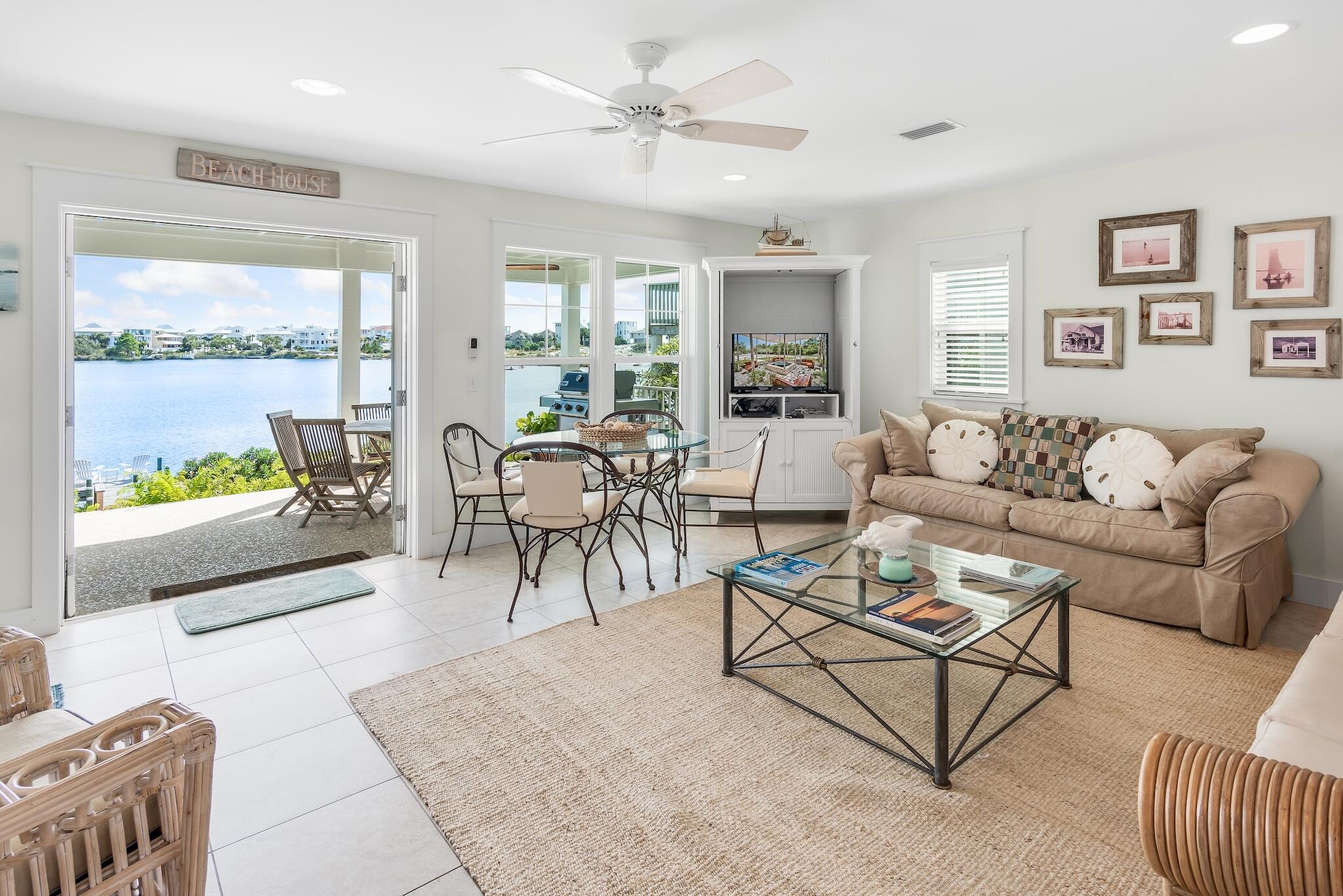 301 South Gulf Drive Santa Rosa Beach, FL 32459 - Photo 3 of 26 a living room with furniture and a large window