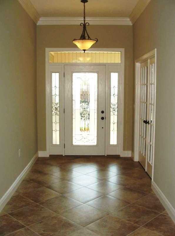 4626 Hermosa Road Crestview, FL 32539 - Photo 3 of 22 a view of an empty room with window and chandelier fan