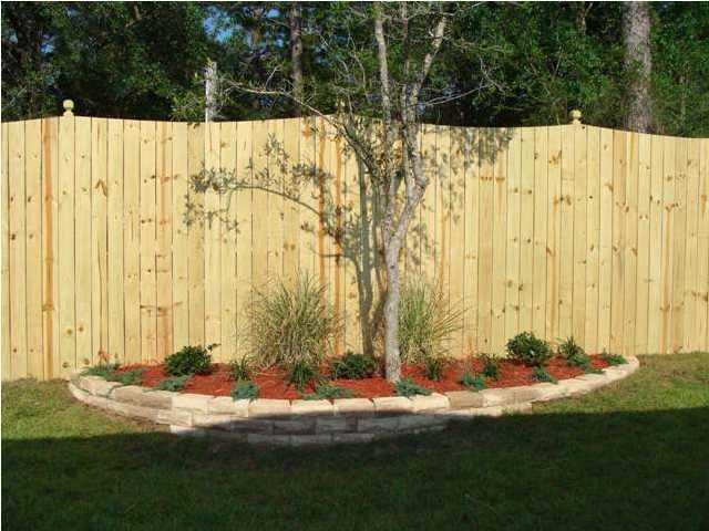 4626 Hermosa Road Crestview, FL 32539 - Photo 22 of 22 a view of a backyard with a small cabin