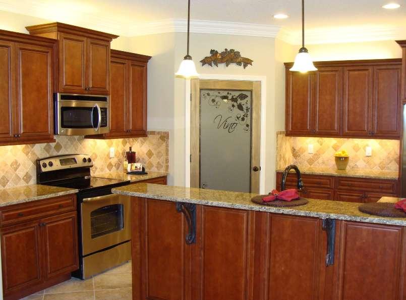 4626 Hermosa Road Crestview, FL 32539 - Photo 7 of 22 a kitchen with stainless steel appliances a stove a sink and cabinets