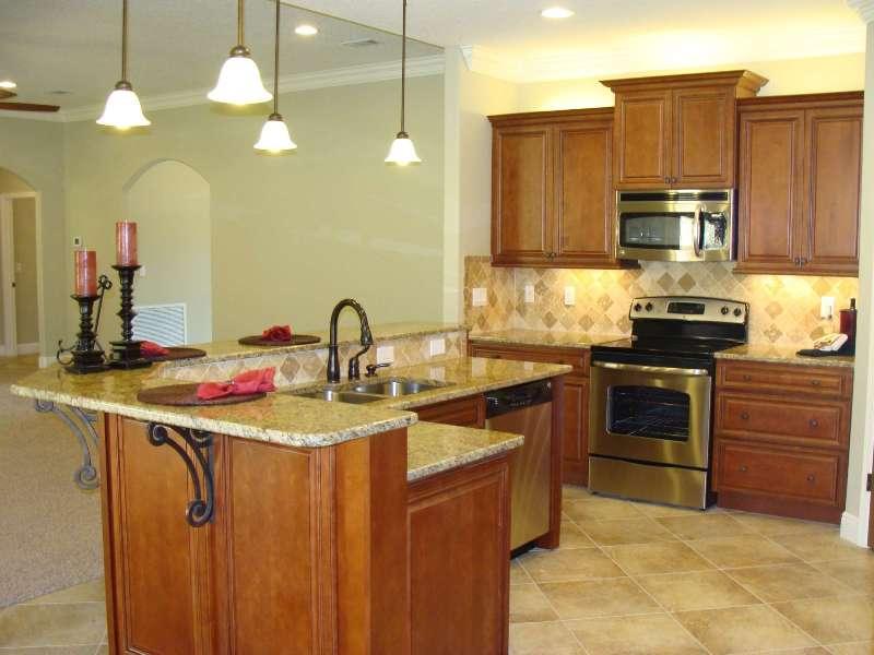 4626 Hermosa Road Crestview, FL 32539 - Photo 9 of 22 a kitchen with stainless steel appliances a sink stove and refrigerator