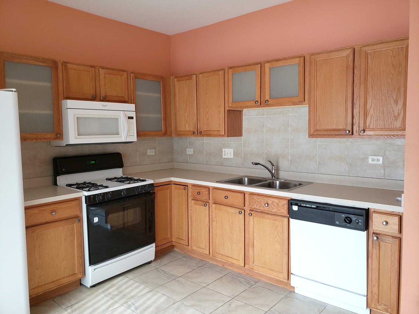 641 West Jonathan Drive Round Lake, IL 60073 - Photo 5 of 20 a kitchen with cabinets appliances and a sink
