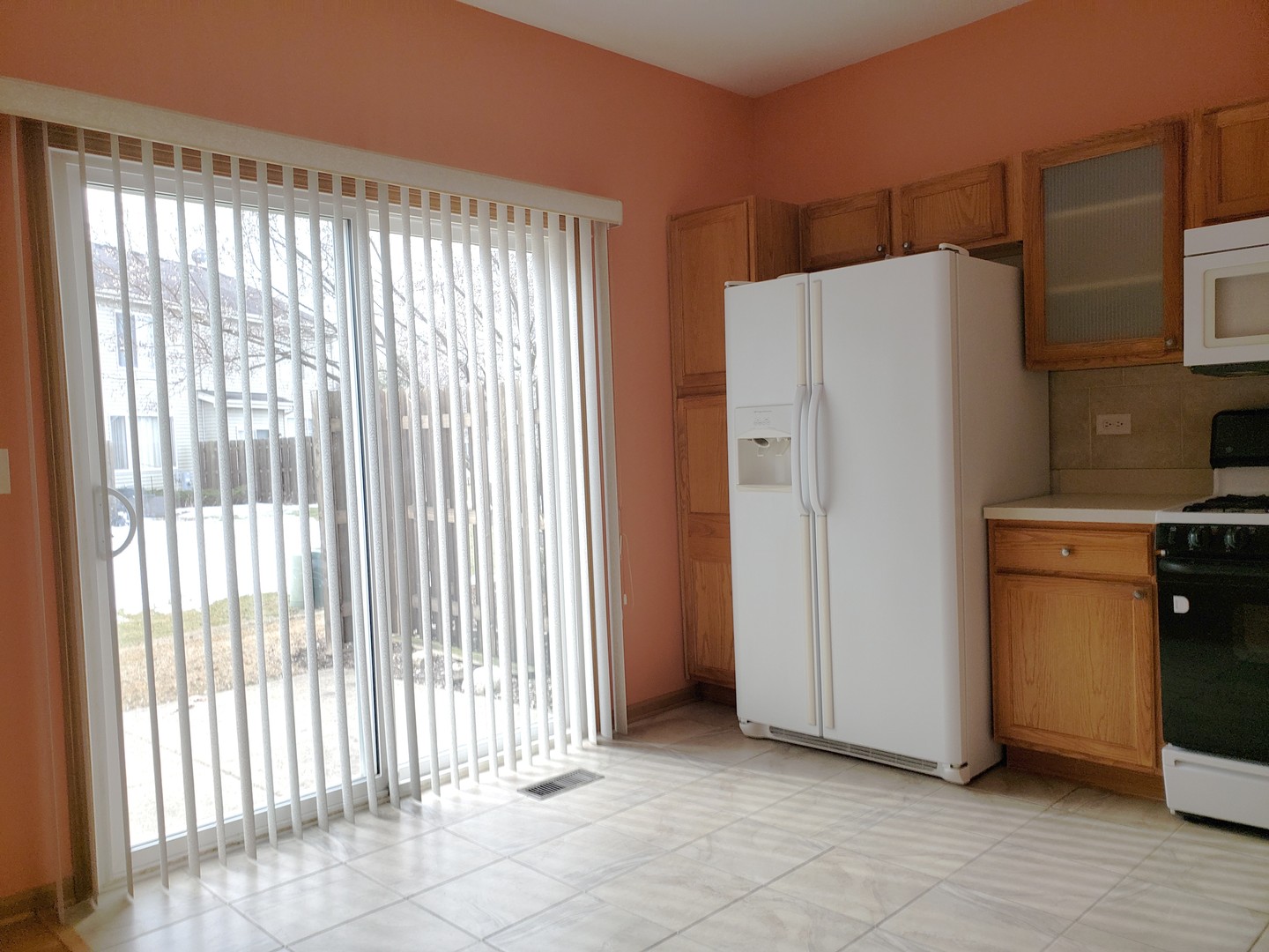 641 West Jonathan Drive Round Lake, IL 60073 - Photo 6 of 20 a view of a kitchen with refrigerator and cabinet
