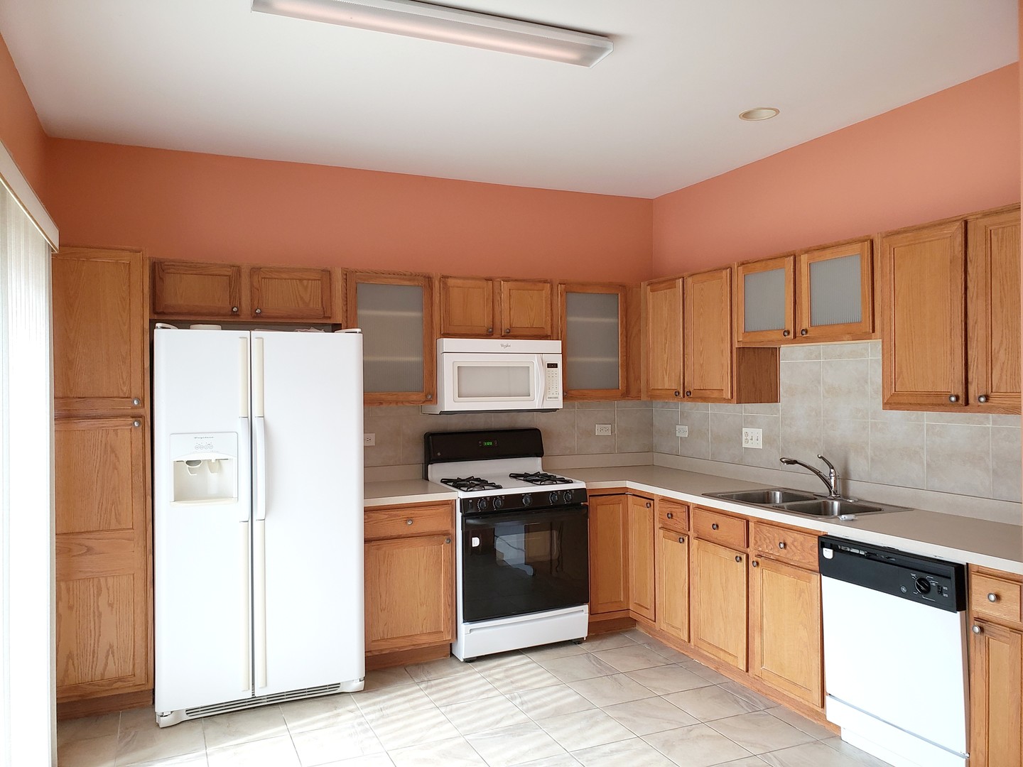 641 West Jonathan Drive Round Lake, IL 60073 - Photo 7 of 20 a kitchen with a sink stove and refrigerator