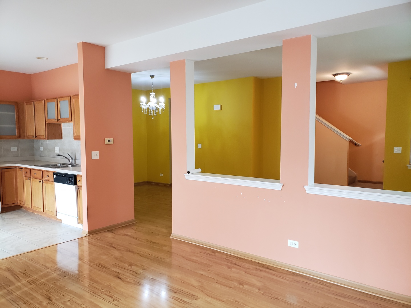 641 West Jonathan Drive Round Lake, IL 60073 - Photo 9 of 20 a view of a hallway with wooden floor and a living room